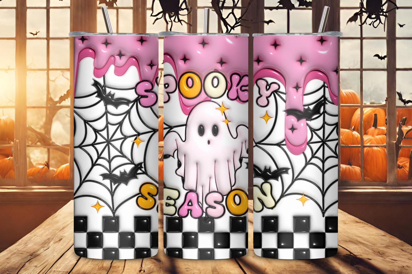 Spooky Season Tumbler featuring a playful ghost and spider web design on a pink background, perfect for Halloween enthusiasts.