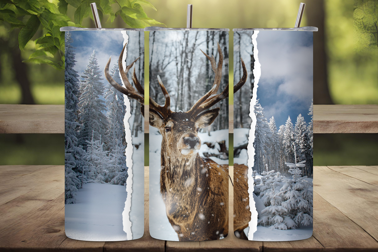 Tumbler featuring a majestic deer in a snowy forest with frosted trees and a serene winter backdrop