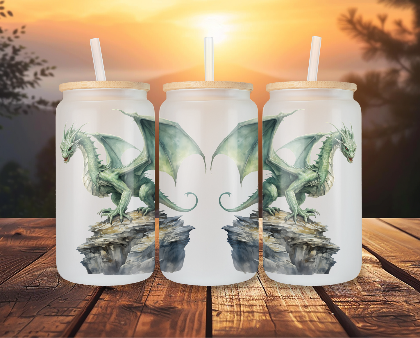 Three frosted glass cans with a white horse design, displayed on a wooden table against a tropical backdrop, each topped with a bamboo lid and clear straw.