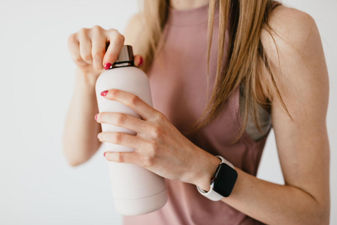 woman holding a tumbler