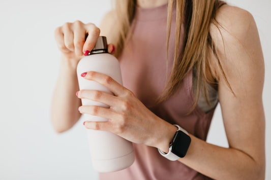 woman holding a tumbler